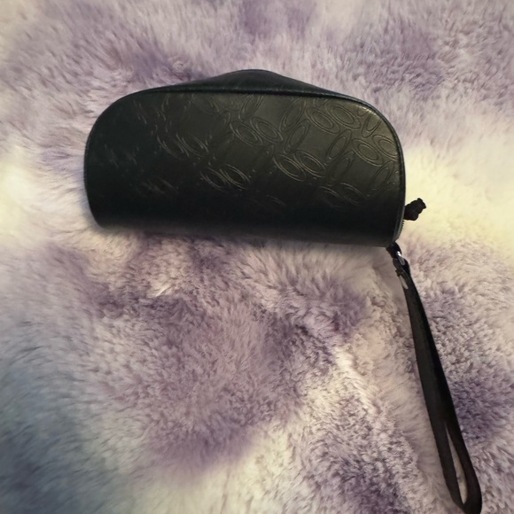 Oakley Handbags - Oakley Elegant Black Clutch Bag